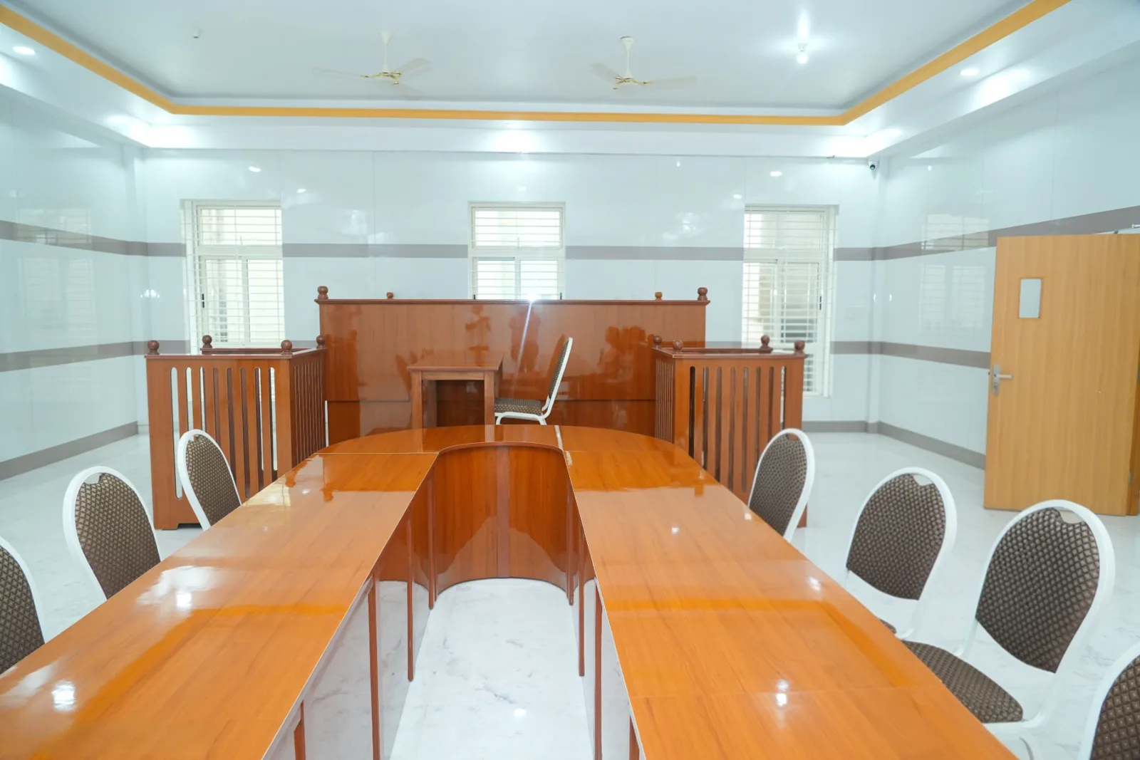 College moot court hall with judge's bench, witness box and counsel tables